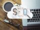 Team of digital marketing experts working at a top SEO agencies in Dubai, analyzing website performance and keyword rankings on screen